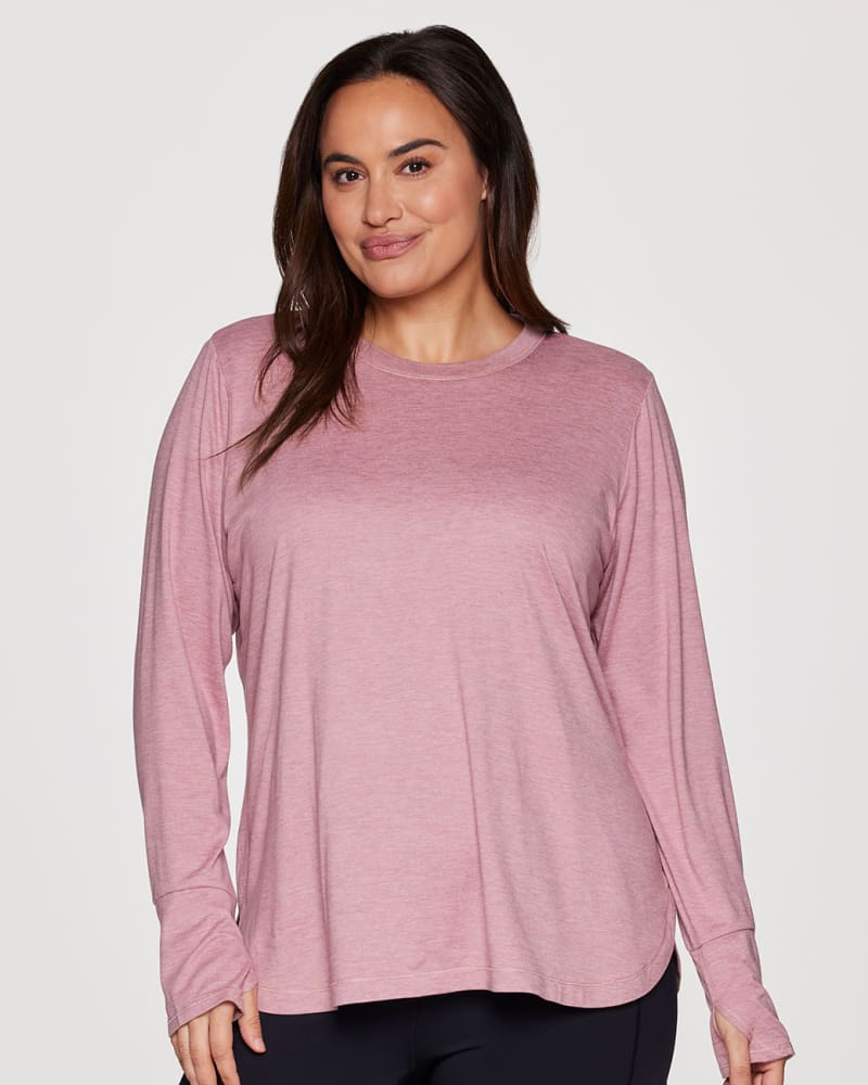 Front of a model wearing a size 3X Plus Studio Practice Long Sleeve Tunic Tee in Light Pink by RBX Active. | dia_product_style_image_id:316137